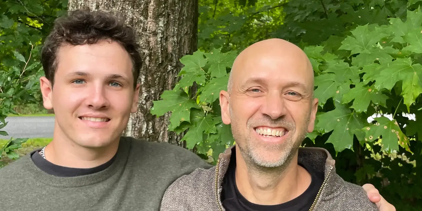 Charlie and Chris Brooks in front of a maple tree